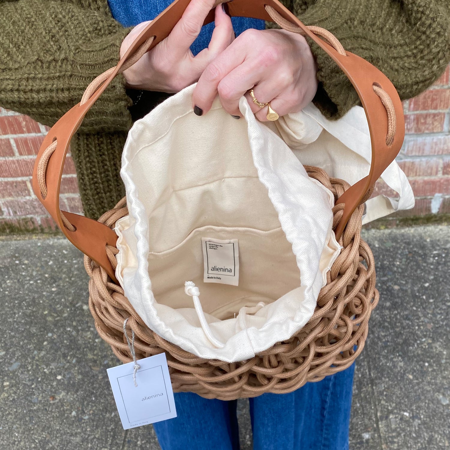 Italian handbag. Small shoulder bag make of woven cotton rope with leather shoulder strap. tan color