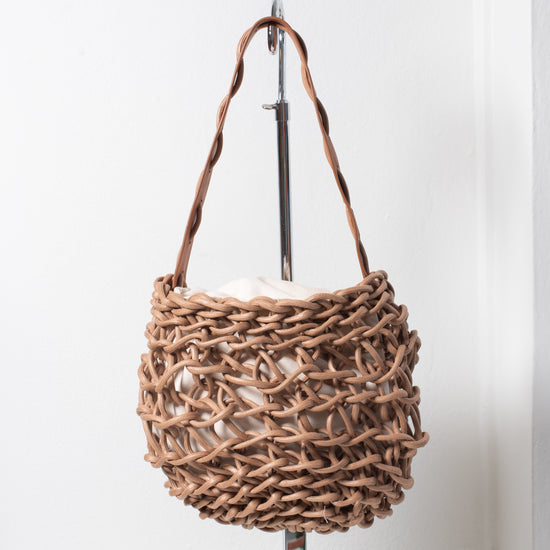 Italian handbag. Small shoulder bag make of woven cotton rope with leather shoulder strap. tan color