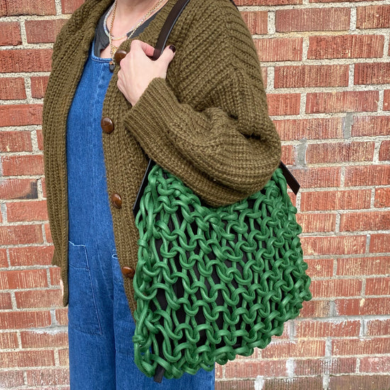 Italian handbag.medium  shoulder bag make of woven cotton rope with leather shoulder strap.green color
