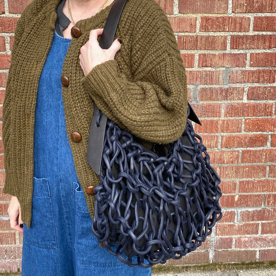 Italian handbag.medium  shoulder bag make of woven cotton rope with leather shoulder strap.navy blue color