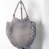 Numero 10 leather shoulder bag with unique puckered detail. Available in elephant grey